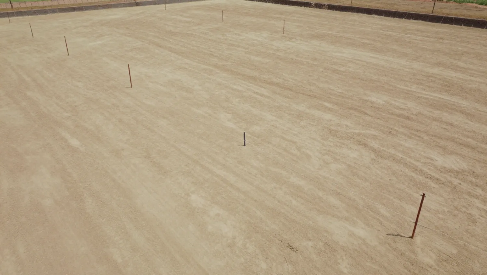 Common Mistakes in Site Preparation (and How to Avoid Them) Sandy terrain has installed boundary markers; work involves site marking with no visible machinery — Daniel Dean Land Clearing, Southeast Texas
