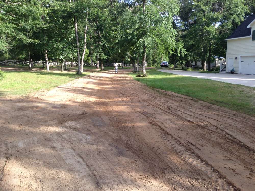 Drainage swale construction directing water flow