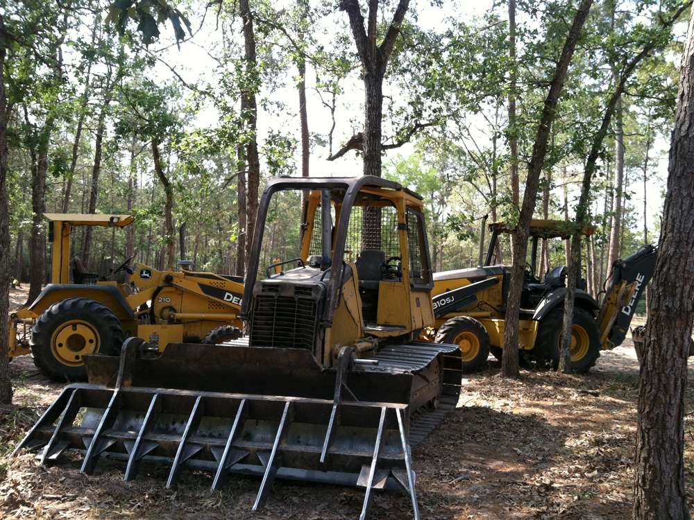 Daniel Dean land clearing equipment working a Magnolia, Texas property