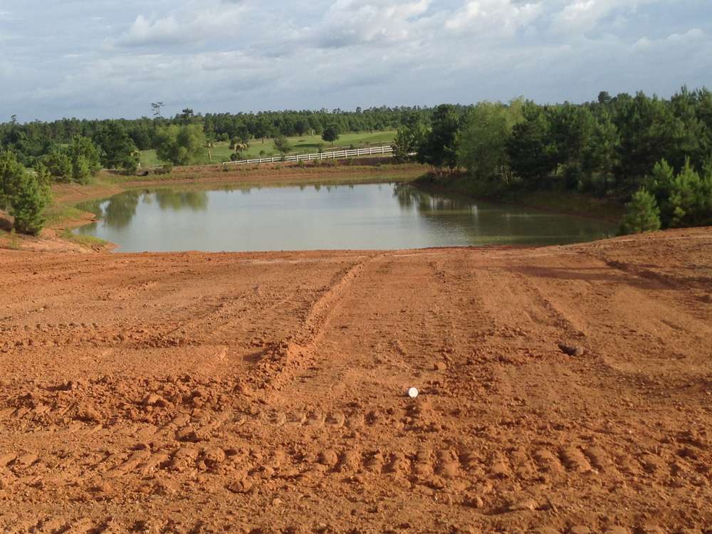 Excavator digging new pond in Southeast Texas