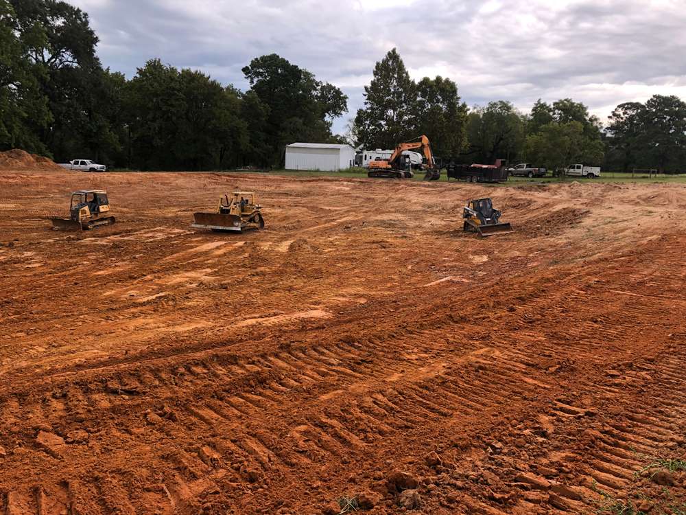 Pond repair compacting clay lining