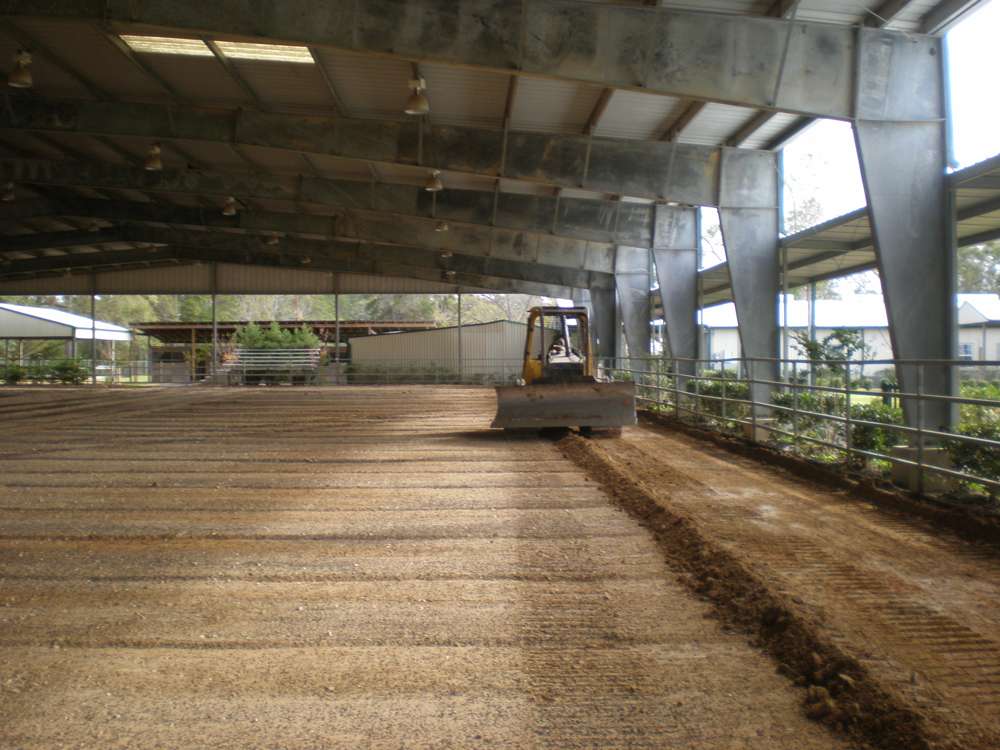 Completed riding arena with proper footing and drainage