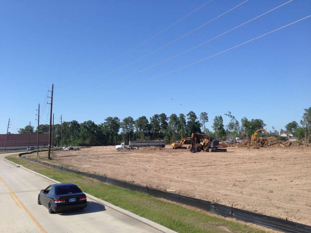 Silt fence protecting waterway from sediment runoff