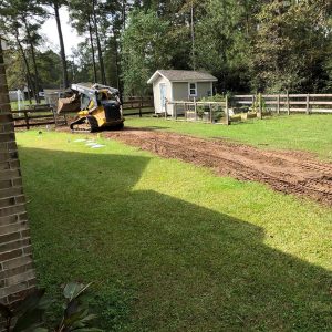 Berm construction in progress for drainage solution