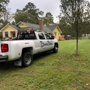 Daniel Dean inspecting property with equipment